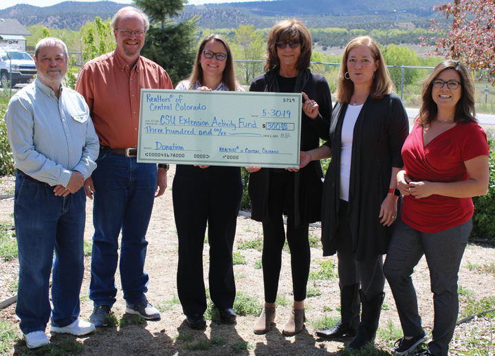Realtors present $300 to CSU Extension